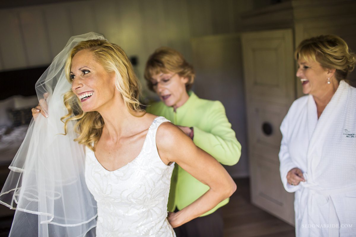 Sedona chapel wedding ~ Anita and Armand's wedding in Sedona - Anita gets ready to get into her wedding gown