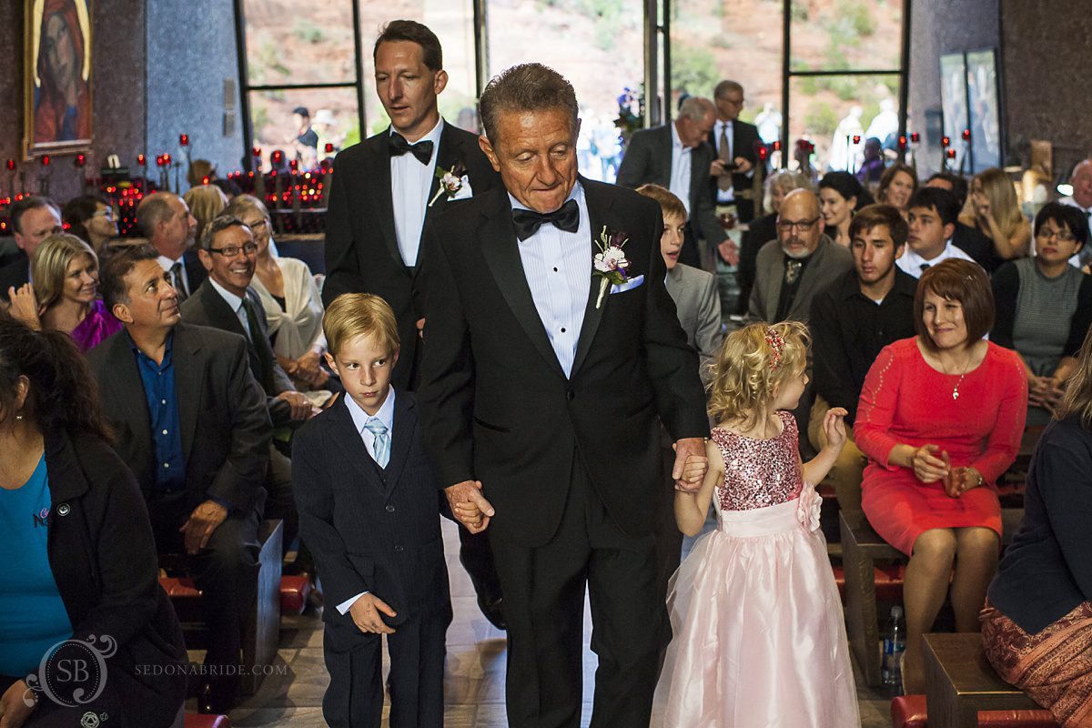 Sedona chapel wedding ~ Anita and Armand's wedding in Sedona - The groom walks up the aisle with his grandkids.