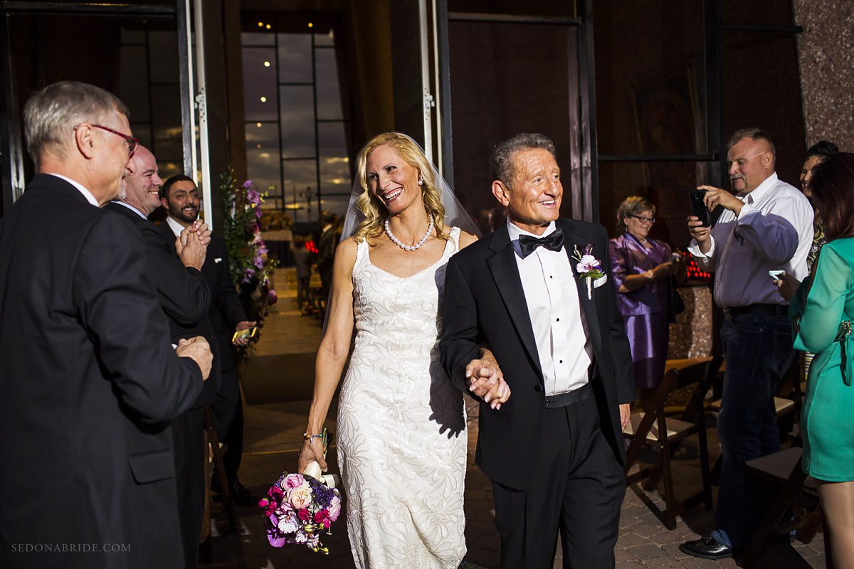 Sedona chapel wedding ~ Anita and Armand's wedding in Sedona - The newlywed couple walking down the aisle!