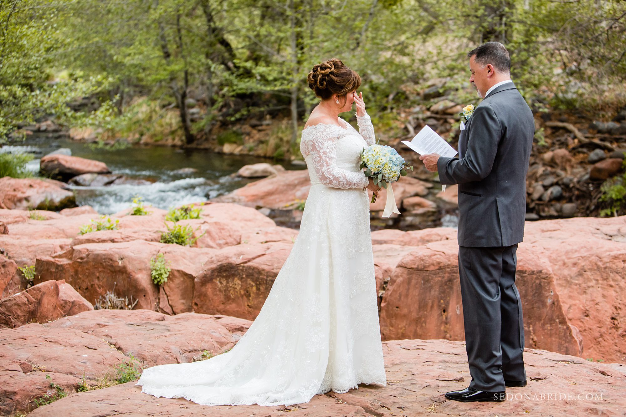 Bride crying during her wedding ceremony at L'Auberge de Sedona