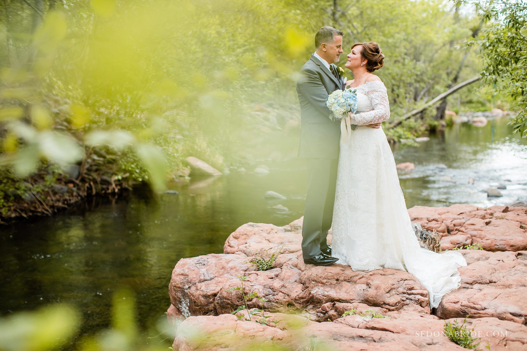 Bride and groom pose for a portrait at Serenity Point 